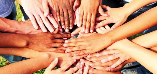 many hands together: group of people joining hands